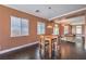 Dining area with modern light fixture and views of the living room at 5528 Stone Lagoon St, North Las Vegas, NV 89031