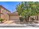 Charming single-story home with a two-car garage and desert landscaping on a sunny day at 5528 Stone Lagoon St, North Las Vegas, NV 89031
