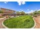 Expansive grassy area within the community, complemented by shaded seating and manicured landscaping at 5528 Stone Lagoon St, North Las Vegas, NV 89031