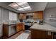 Well-equipped kitchen featuring stainless steel appliances, wood cabinets, and a skylight at 573 Sellers Pl, Henderson, NV 89011