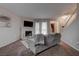 Comfortable living room featuring a fireplace, plush seating, and a staircase at 573 Sellers Pl, Henderson, NV 89011
