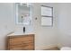 Modern bathroom with wood cabinet, white countertop, and contemporary fixtures at 5834 Autumn Harvest Ave, Las Vegas, NV 89142