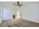 Spacious bedroom with neutral walls, carpet, a ceiling fan, and an ensuite bathroom at 5834 Autumn Harvest Ave, Las Vegas, NV 89142