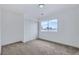Inviting bedroom with carpet, white walls, a window, and a closet with sliding doors at 5834 Autumn Harvest Ave, Las Vegas, NV 89142