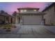 Two-story home with a tile roof, a two-car garage, and low-maintenance landscaping at 5834 Autumn Harvest Ave, Las Vegas, NV 89142