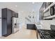 Kitchen with stainless steel appliances, sleek cabinetry, and modern fixtures at 5834 Autumn Harvest Ave, Las Vegas, NV 89142