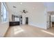 Bright, open-concept space with hardwood floors, modern ceiling fan and lots of natural light at 5834 Autumn Harvest Ave, Las Vegas, NV 89142