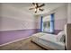 Comfortable bedroom showcasing custom paint, plush carpet, and an inviting atmosphere at 5992 Quintillion Ave, Las Vegas, NV 89122
