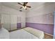 Inviting bedroom featuring neutral tones, ample closet space, and comfortable carpet at 5992 Quintillion Ave, Las Vegas, NV 89122
