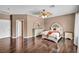 Bedroom with a ceiling fan, hardwood floors, and furniture set at 5992 Quintillion Ave, Las Vegas, NV 89122