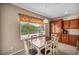 Bright dining area with large window and pendant lighting at 5992 Quintillion Ave, Las Vegas, NV 89122