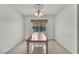 Bright dining room featuring a chandelier and a window overlooking the well maintained backyard at 5992 Quintillion Ave, Las Vegas, NV 89122