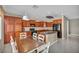 Open kitchen features granite counters, stainless appliances, and ample cabinet space at 5992 Quintillion Ave, Las Vegas, NV 89122