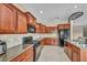 Well-equipped kitchen features granite counters, stainless appliances, and tile backsplash at 5992 Quintillion Ave, Las Vegas, NV 89122