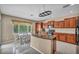 Sunlit eat-in kitchen with stainless appliances, granite counters, and ample cabinet space at 5992 Quintillion Ave, Las Vegas, NV 89122