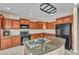 Well-equipped kitchen features granite countertops, stainless steel appliances, and ample cabinet space at 5992 Quintillion Ave, Las Vegas, NV 89122