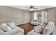 Spacious living room with wood floors and ample seating at 5992 Quintillion Ave, Las Vegas, NV 89122