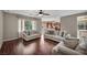 Large living room with wood floors, neutral paint and open floor plan at 5992 Quintillion Ave, Las Vegas, NV 89122