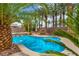 Beautiful pool area with lush palm trees offers a refreshing escape and creates a private backyard retreat at 5992 Quintillion Ave, Las Vegas, NV 89122