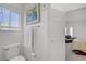 Bright white bathroom featuring a modern toilet and view into the bedroom at 6140 Galileo Dr, Las Vegas, NV 89149