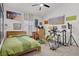 A casual bedroom is decorated with an eclectic collection of art at 6140 Galileo Dr, Las Vegas, NV 89149