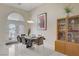 Bright dining room featuring a table set for six, a cabinet and ample natural light at 6140 Galileo Dr, Las Vegas, NV 89149
