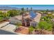 This beautiful home features solar panels, a stone facade, and desert landscaping at 6140 Galileo Dr, Las Vegas, NV 89149