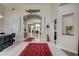 Elegant foyer with marble floors, decorative rugs and column accents at 6140 Galileo Dr, Las Vegas, NV 89149