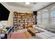 Comfortable living room with built-in shelving and plantation shutters at 6140 Galileo Dr, Las Vegas, NV 89149