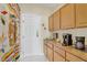 Mud room area with wooden cabinets, door to the outside, and storage space at 6140 Galileo Dr, Las Vegas, NV 89149