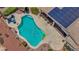 Aerial view of a private pool with lounge chairs on the patio at 6140 Galileo Dr, Las Vegas, NV 89149