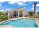Backyard swimming pool with lush landscaping and home exterior view at 6140 Galileo Dr, Las Vegas, NV 89149