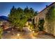 Beautifully landscaped side yard features a stone path and lush greenery at 6140 Galileo Dr, Las Vegas, NV 89149