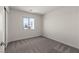 Cozy bedroom featuring carpet floors, white walls, and a bright window at 6185 Blood Lily Ave, Las Vegas, NV 89122