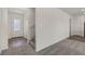 Welcoming entryway with carpeted stairs and modern finishes at 6185 Blood Lily Ave, Las Vegas, NV 89122