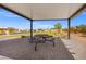 Community patio features a picnic table with views of playground and neighborhood at 6185 Blood Lily Ave, Las Vegas, NV 89122
