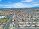 Expansive aerial view of a neighborhood showcasing community layout and surrounding landscape and mountain views at 6405 Break Point Ave, Las Vegas, NV 89130