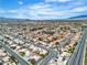 Extensive aerial shot showing the neighborhood and mountain backdrop at 6405 Break Point Ave, Las Vegas, NV 89130