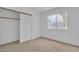Bedroom with window and closet, featuring a neutral carpet at 6405 Break Point Ave, Las Vegas, NV 89130