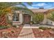 Inviting front entrance with a brick walkway and meticulous desert landscaping leading to the front door at 6405 Break Point Ave, Las Vegas, NV 89130