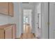 Hallway with neutral tile and access to the backyard and bedroom at 6405 Break Point Ave, Las Vegas, NV 89130