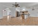 Open living area features tile flooring and easy access to the kitchen at 6405 Break Point Ave, Las Vegas, NV 89130