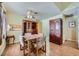 Cozy dining room featuring wood-look flooring and neutral paint at 6766 Sebring St, Las Vegas, NV 89103