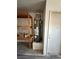 Close up shot of garage featuring a hot water heater and wooden storage shelves at 6766 Sebring St, Las Vegas, NV 89103