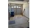 Open garage featuring a roll-up door and ample space for parking and storage at 6766 Sebring St, Las Vegas, NV 89103
