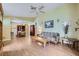 Bright and airy living room with a ceiling fan, wood-look flooring, and neutral paint at 6766 Sebring St, Las Vegas, NV 89103