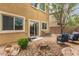 Backyard area offering outdoor seating and a patio area with landscape details at 6788 Sharks Bay Ct, Las Vegas, NV 89149