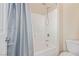 Bathroom showcasing a tub-shower combination with a blue shower curtain at 6788 Sharks Bay Ct, Las Vegas, NV 89149
