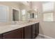 This bathroom features dual sinks and a large mirror at 6788 Sharks Bay Ct, Las Vegas, NV 89149