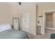 This bedroom features a ceiling fan and a door for privacy at 6788 Sharks Bay Ct, Las Vegas, NV 89149